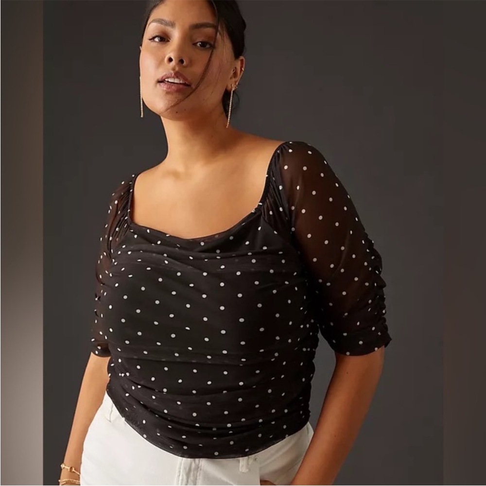 By Anthropologie Semi sheer polka dot black fitted top.  size L